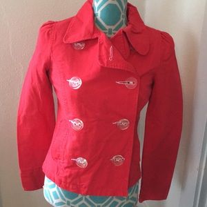 Red double breasted jacket with clear buttons